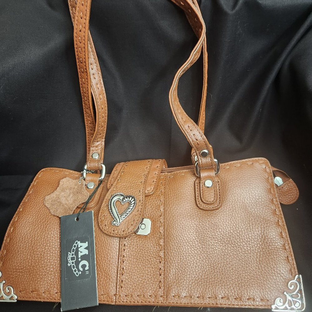 Saddle tan leather ladies handbag